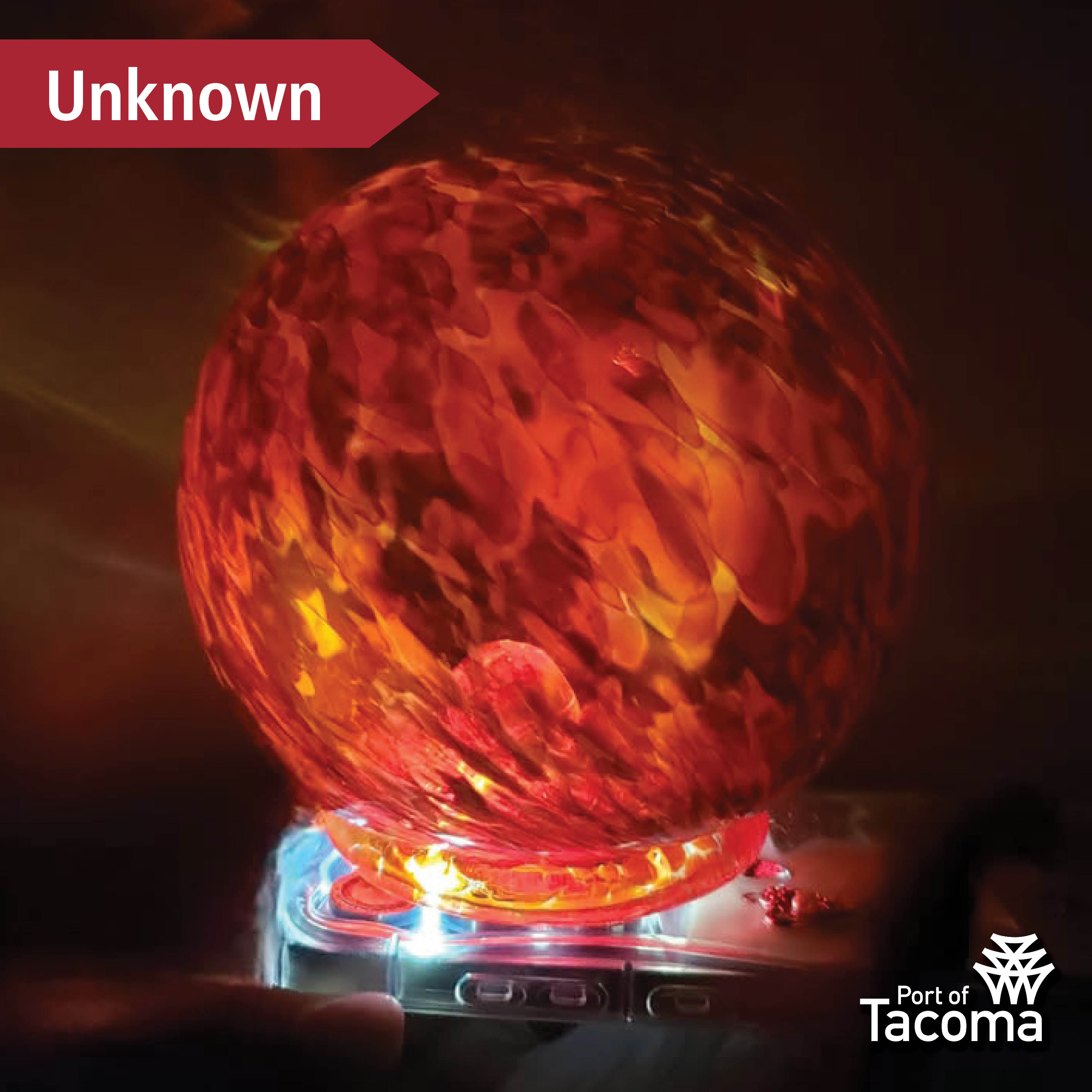 Up close shot of a red Monkeyshines token with the word "Unknown" typed in the corner