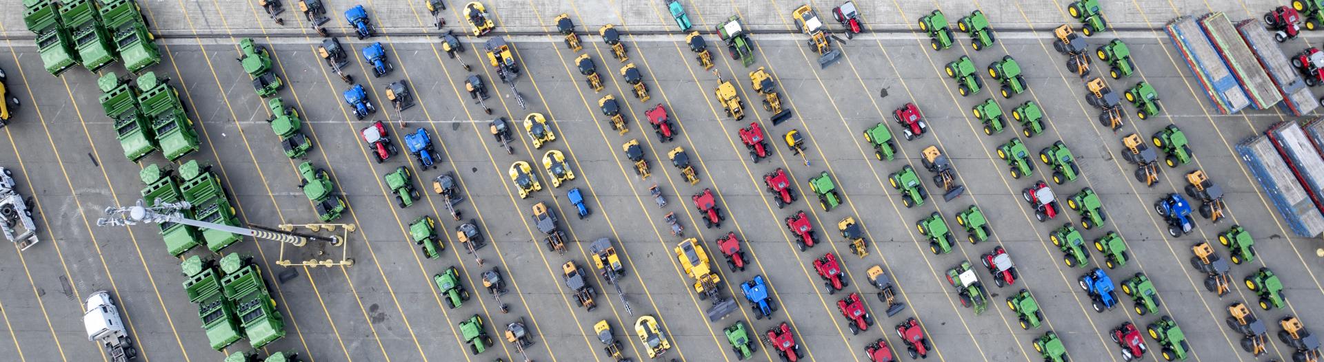 Aerial view of the East Blair One terminal lot filled with colorful farm equipment parked diagonally