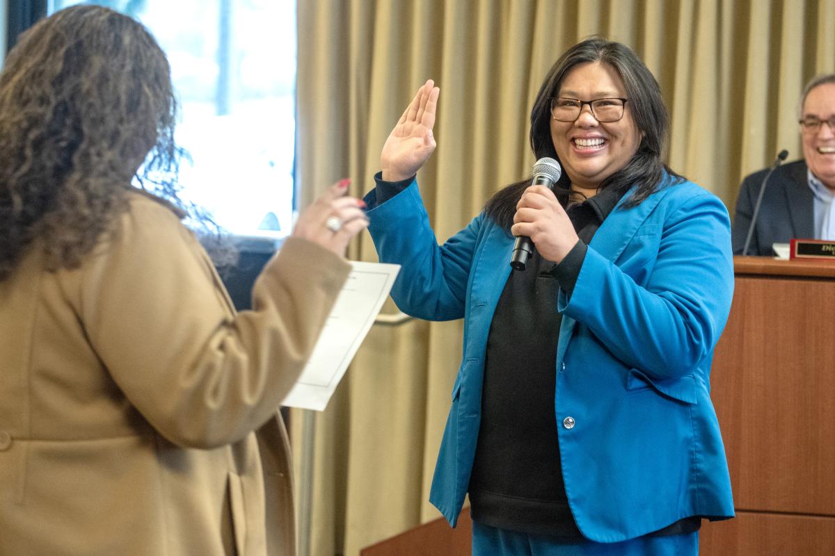 Puyallup Tribe of Indians council member Anna Bean, left, swears in Commissioner Kristin Ang to her second term on the Port of Tacoma commission.