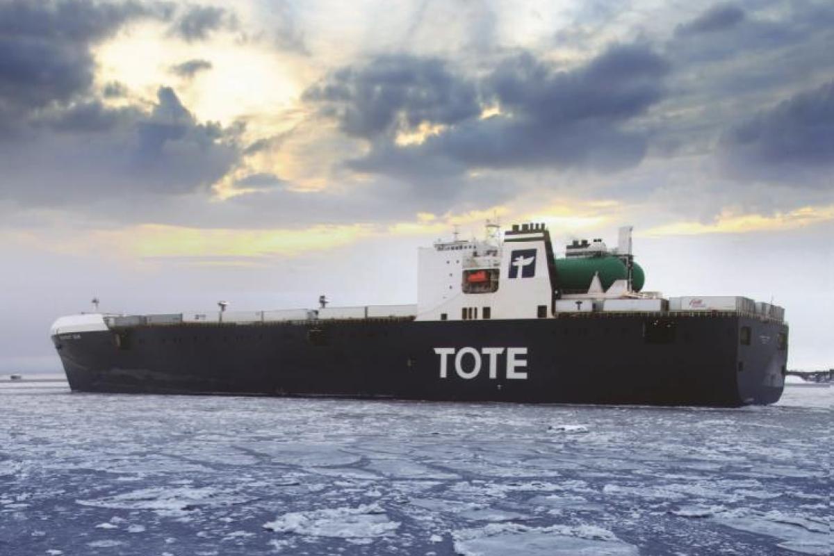 The tote ship Orca in icy Alaskan waters on a cloudy day