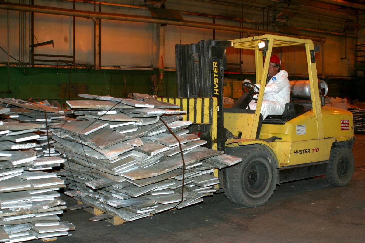 photo of a forklift moving debris