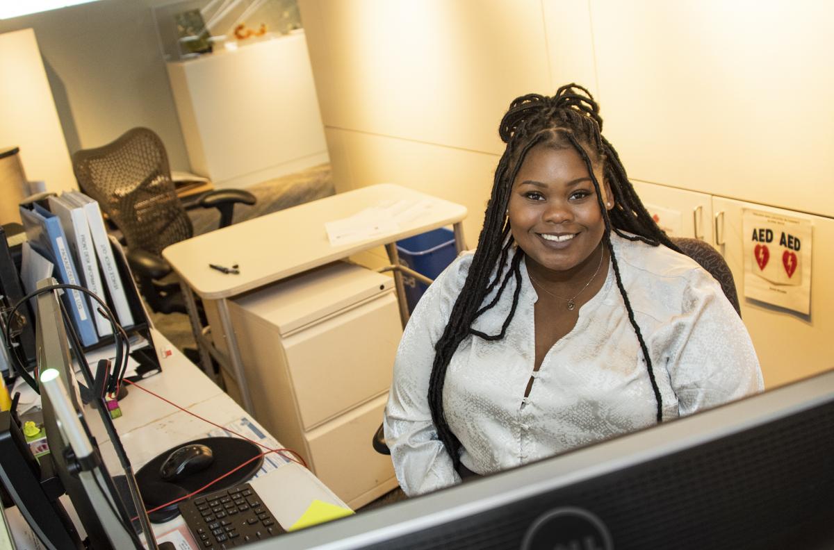 photo of a woman at a reception desk