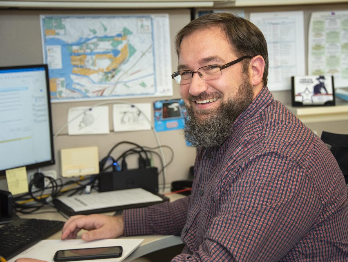 photo of a man working at a desk