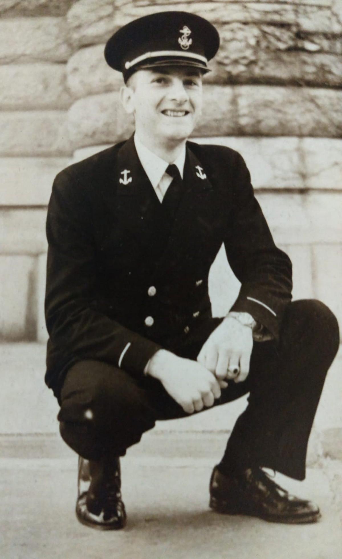 photo of a man in military uniform kneeling
