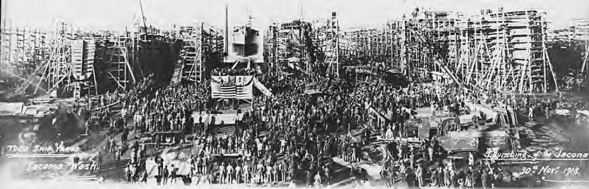 historical photo of people gathered at a shipyard