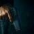 criminal-with-revolver-on-dark-background-photo