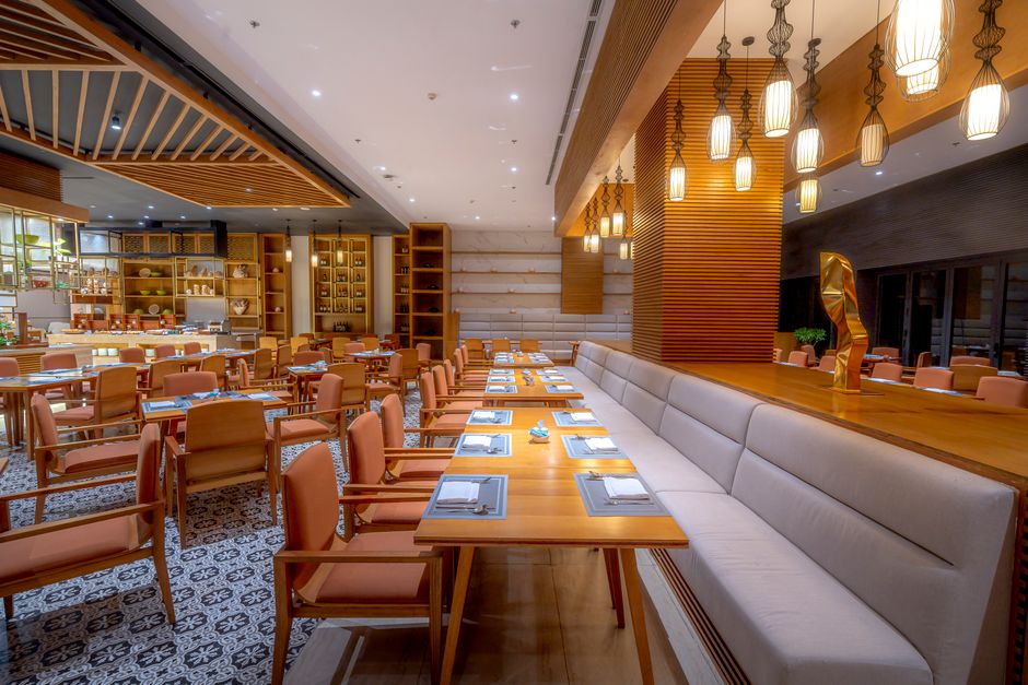 Flour and Salt farmhouse bakery interior with mismatched wooden tables and morning light