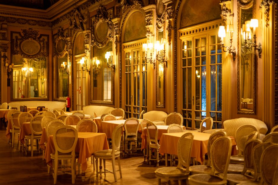 The zinc bar and checkered tile floors of Chez Camille French bistro in Palo Alto
