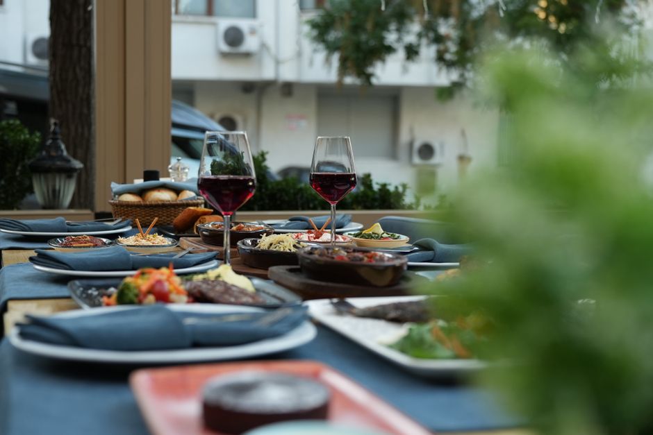 Thalassa courtyard dining beneath olive trees in Menlo Park
