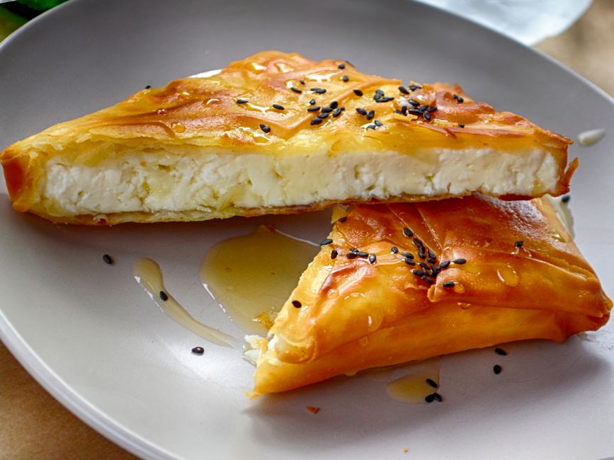 Saganaki Kefalograviera at Thalassa — pan-seared aged sheep's milk cheese with thyme honey