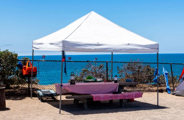 Secure a canopy tent on the sand 