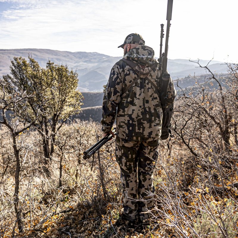 Travis Price and Rifle