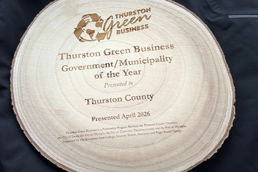 Image of a planed section of a tree log inscribed as an award for Thurston County Green Municipality of 2026
