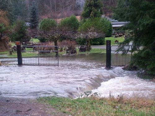 Floodwaters over a road and driveway in 2017 on Michigan Hill in Southwest Thurston County.