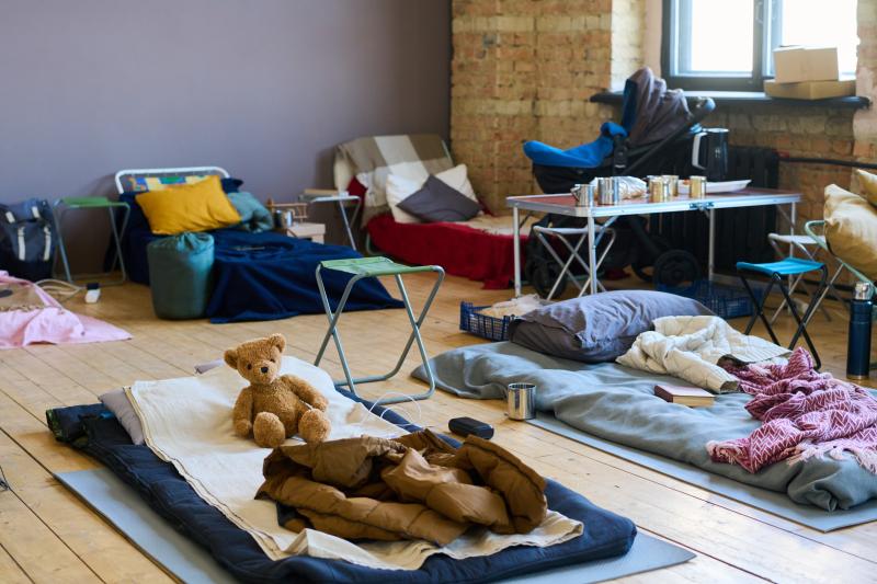 homeless shelter, cots on floor