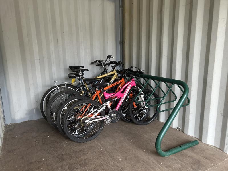 Bikes parked side-by-side in bike rack.