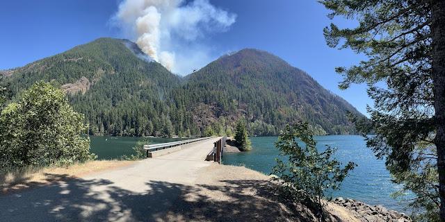image of smoke rising above mountain top 