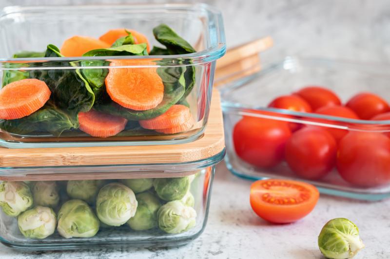 Various vegetables in glass containers: