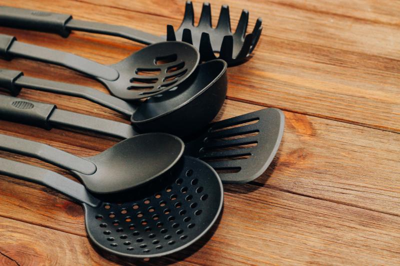 Kitchen tools plastic for multicooker on a wooden table stock photo