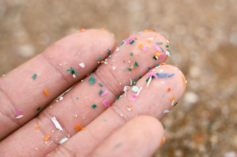 lose up side shot of microplastics lay on a person's hand