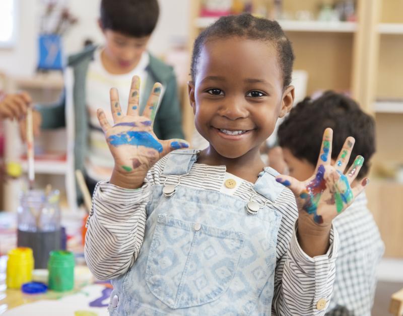 Student with messy hands in classroom