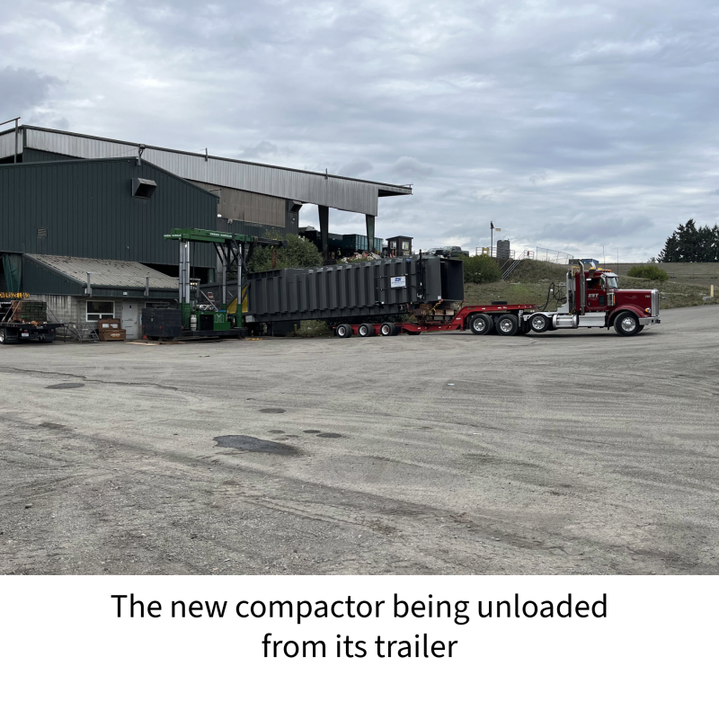 the new compactor at the warc being unloaded from its trailer