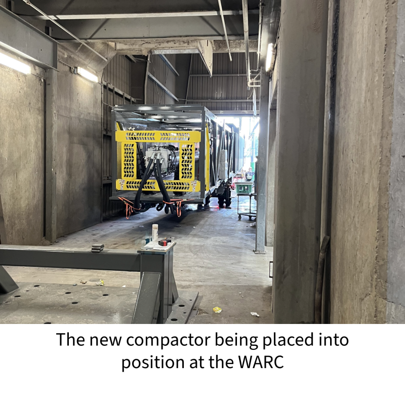 the new compactor being positioned into its resting place at the WARC