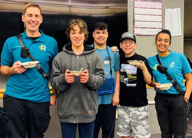 Image of CRU Members and Project SAFER participates smiling together at a meet and greet event 