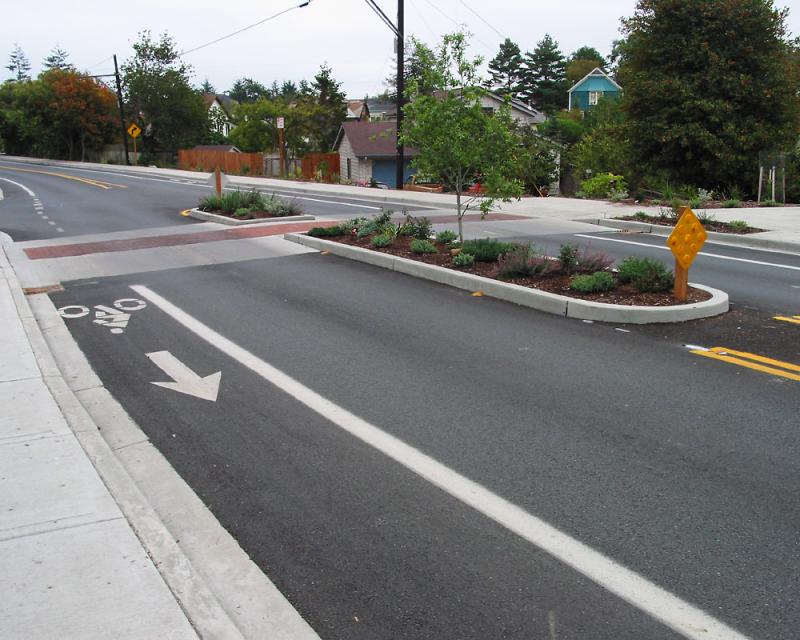 an example of what a median could look like. a concrete island barrier stands between two opposing lanes