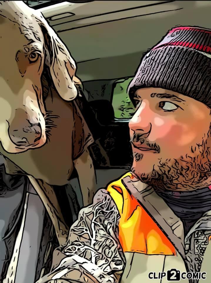 Comic-style filtered photo of John wearing a beanie and orange safety vest sitting in a vehicle with a light-colored dog. John and dog are facing each other inside the car.