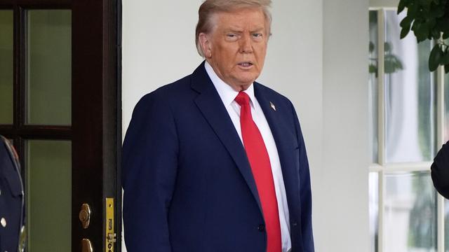 President Donald Trump stands before greeting Ukraine's President Volodymyr Zelenskyy as he arrives at the White House, Monday, Aug. 18, 2025, in Washington. (AP Photo/Alex Brandon)