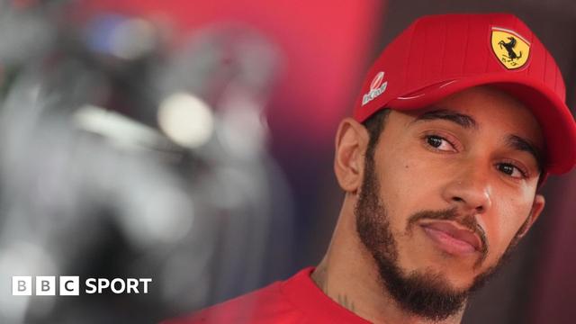 Lewis Hamilton pictured at the Belgian Grand Prix wearing a Ferrari cap
