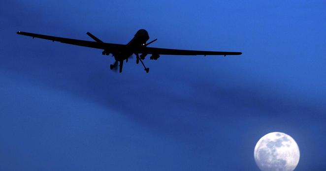 FILE - In this Jan. 31, 2010, file photo, an unmanned U.S. Predator drone flies over Kandahar Air Field, southern Afghanistan, on a moon-lit night. The White House has a released a version of President Barack Obama’s three-year-old directive on the use of lethal force against terrorists overseas, laying out what it says are safeguards to minimize civilian deaths and errant strikes while preserving the capability to take quick action with drone attacks and other means.(AP Photo/Kirsty Wigglesworth, File)