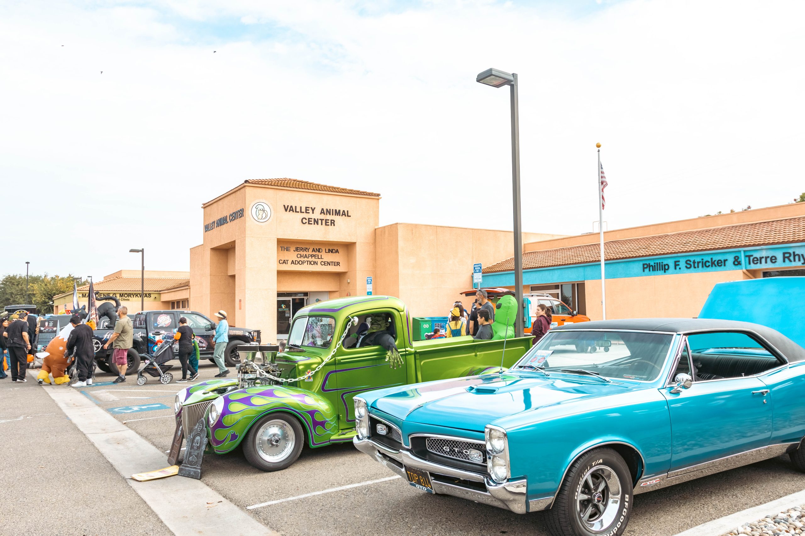 Green and turquoise classic vehicles displayed at Valley Animal Center’s Trunk-or-Treat
