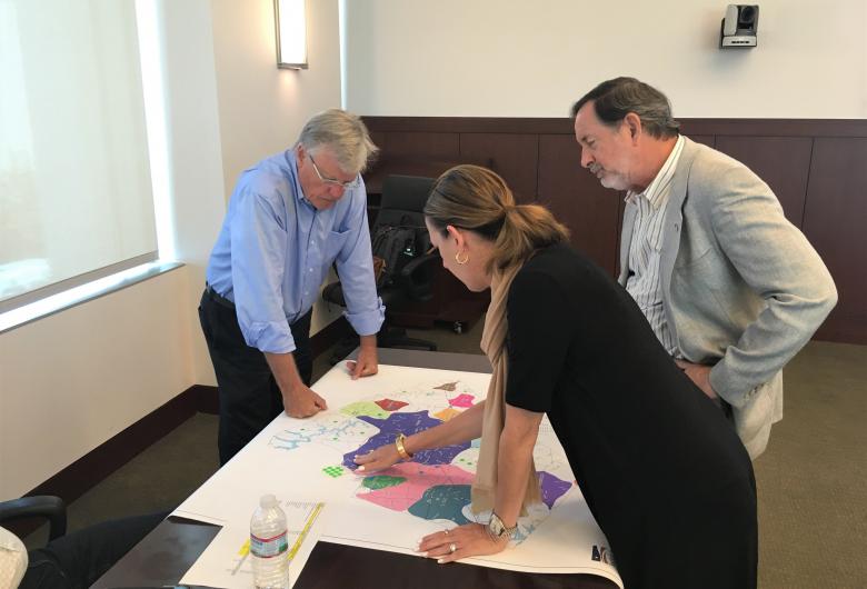 Planning Board members interact with planning maps