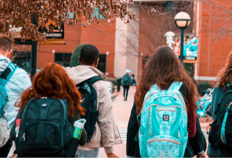 Group of young adults walking into class