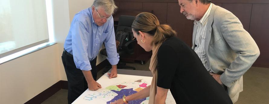 Planning Board members interact with planning maps