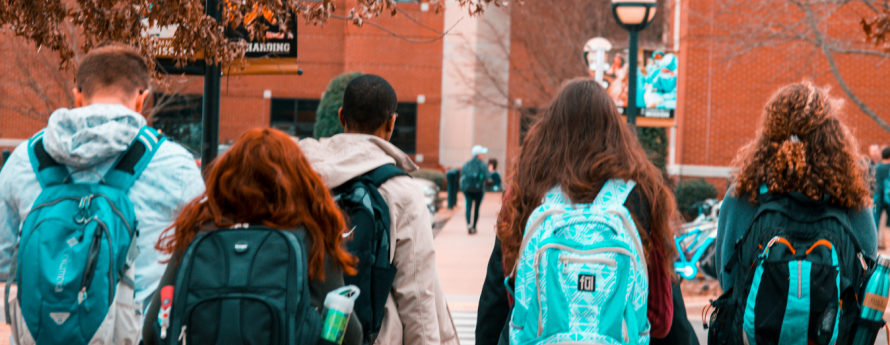 Group of young adults walking into class