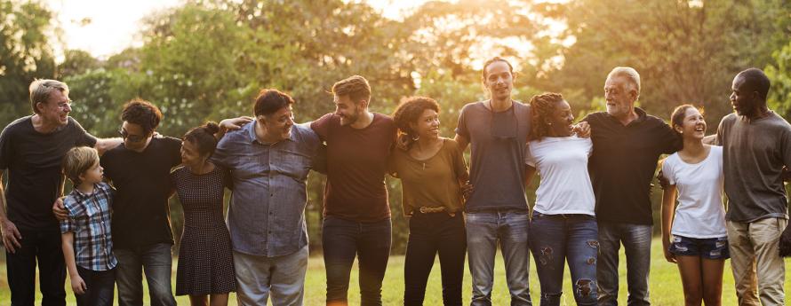 group of people support in unity with arms around each other