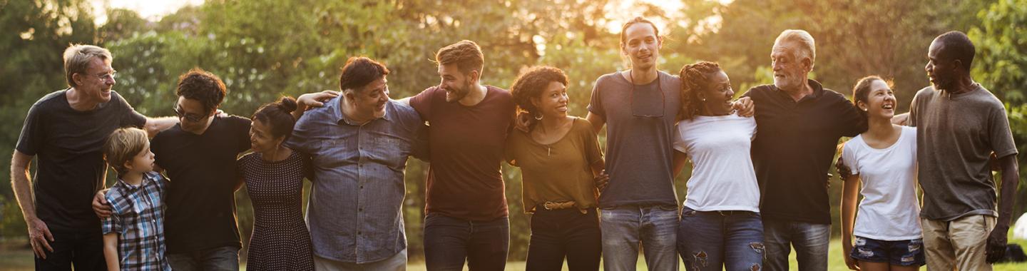 group of people support in unity with arms around each other