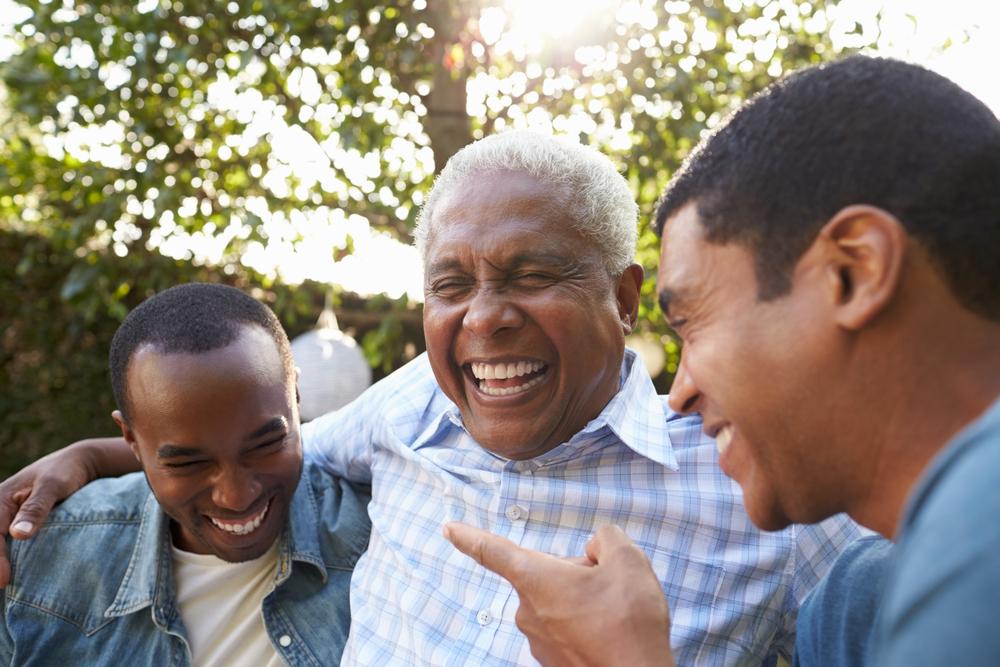 Three men smiling