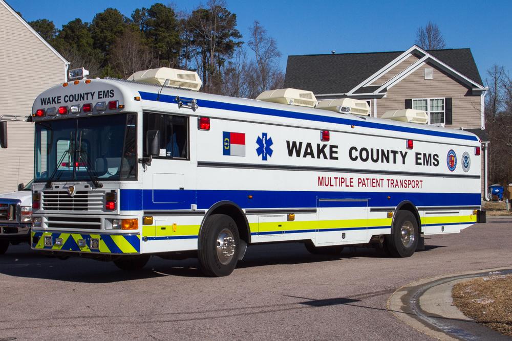 EMS multiple patient transport ambulance parked on a sunny street