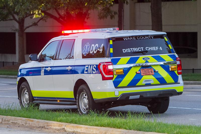 District Chief vehicle with flashing lights on the scene of a call