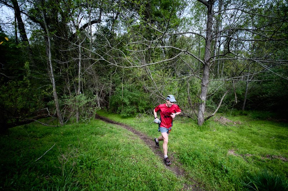 Picture of a trail runner in a red shirt