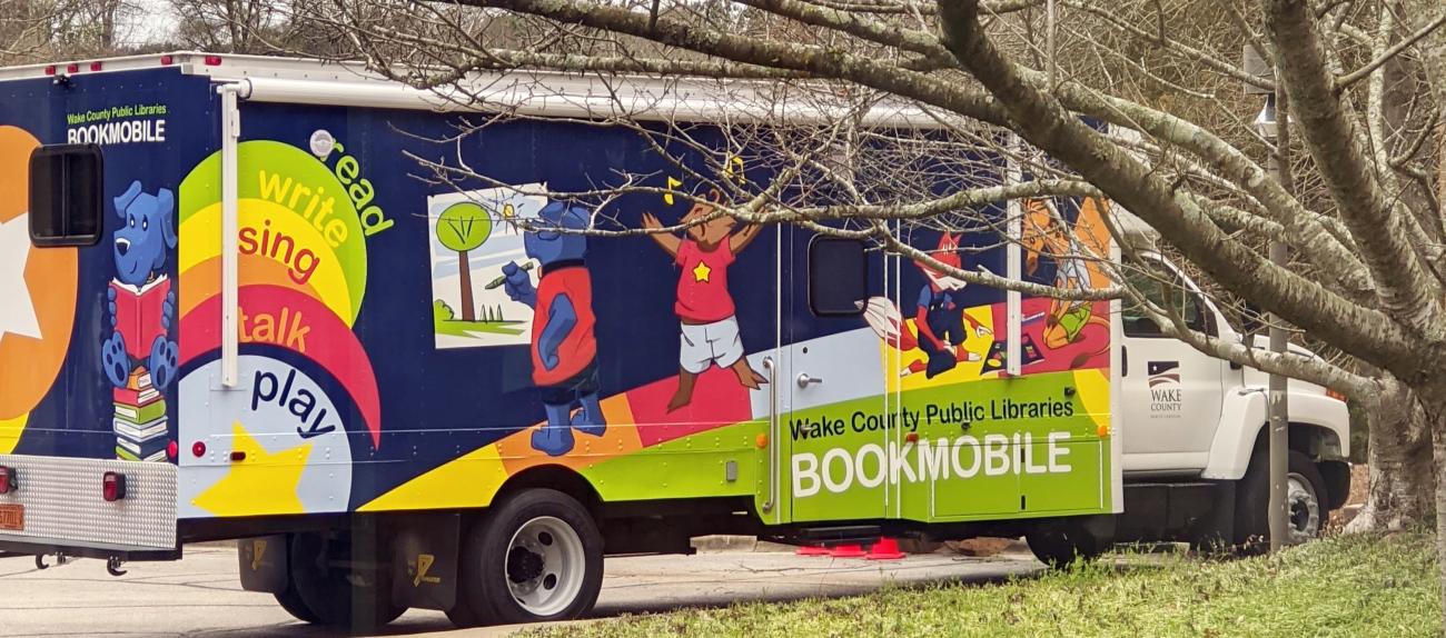 WCPL Bookmobile among the trees on a cloudy day