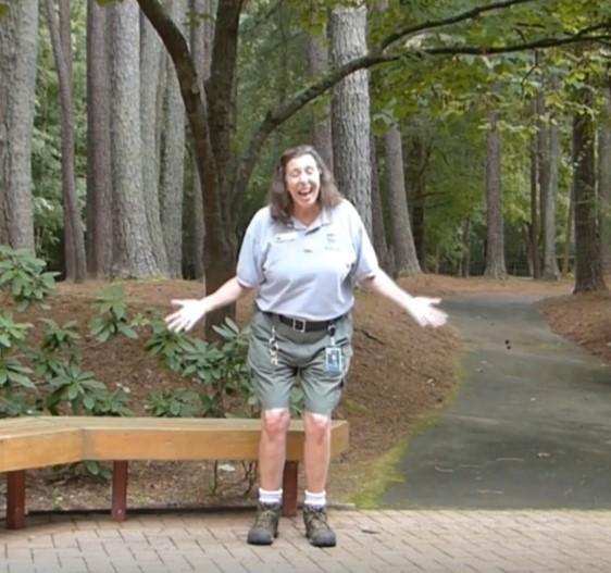 Instructor encouraging her virtual participants to get up and move like an animal.