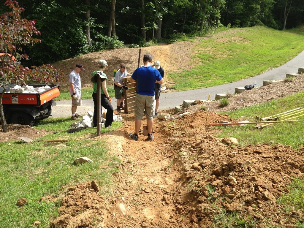 TORC volunteers and park staff repairing section of mountain biking trail.