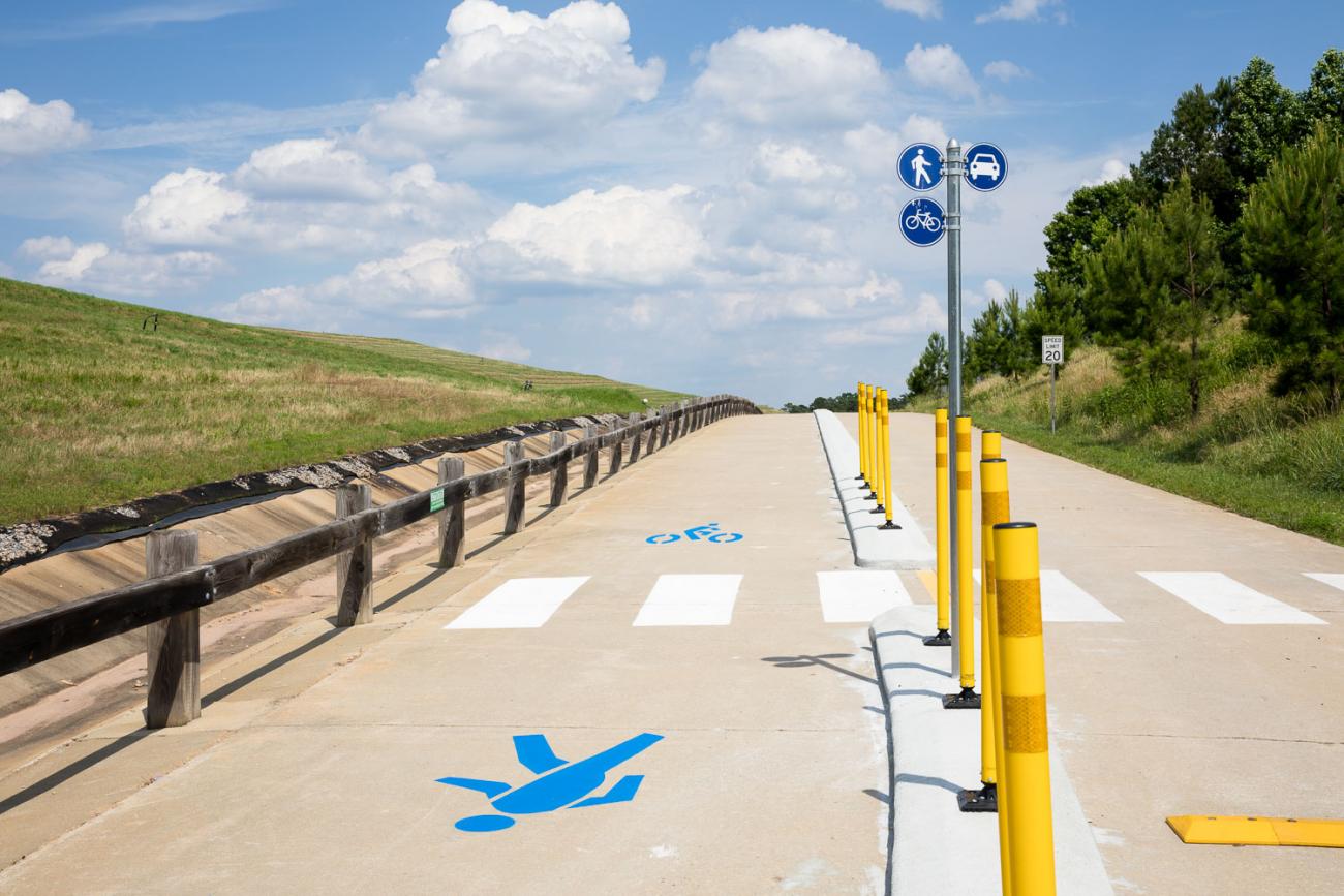 Pedestrian and vehicular lane separated by raised concrete curb