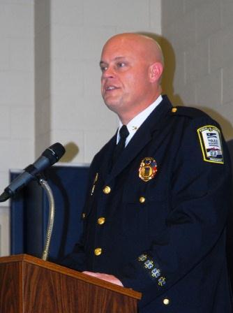 Jon Olson giving a speech at a podium
