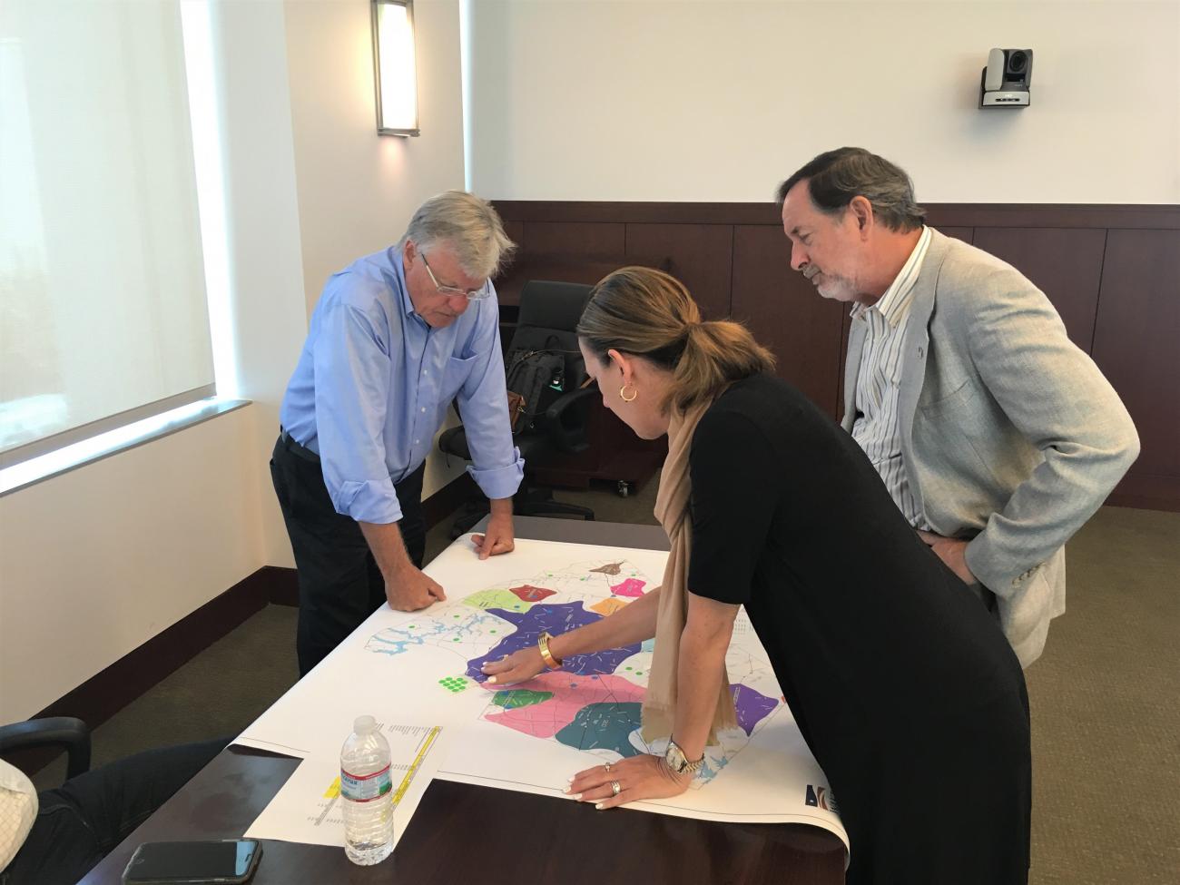 Planning Board members interact with planning maps